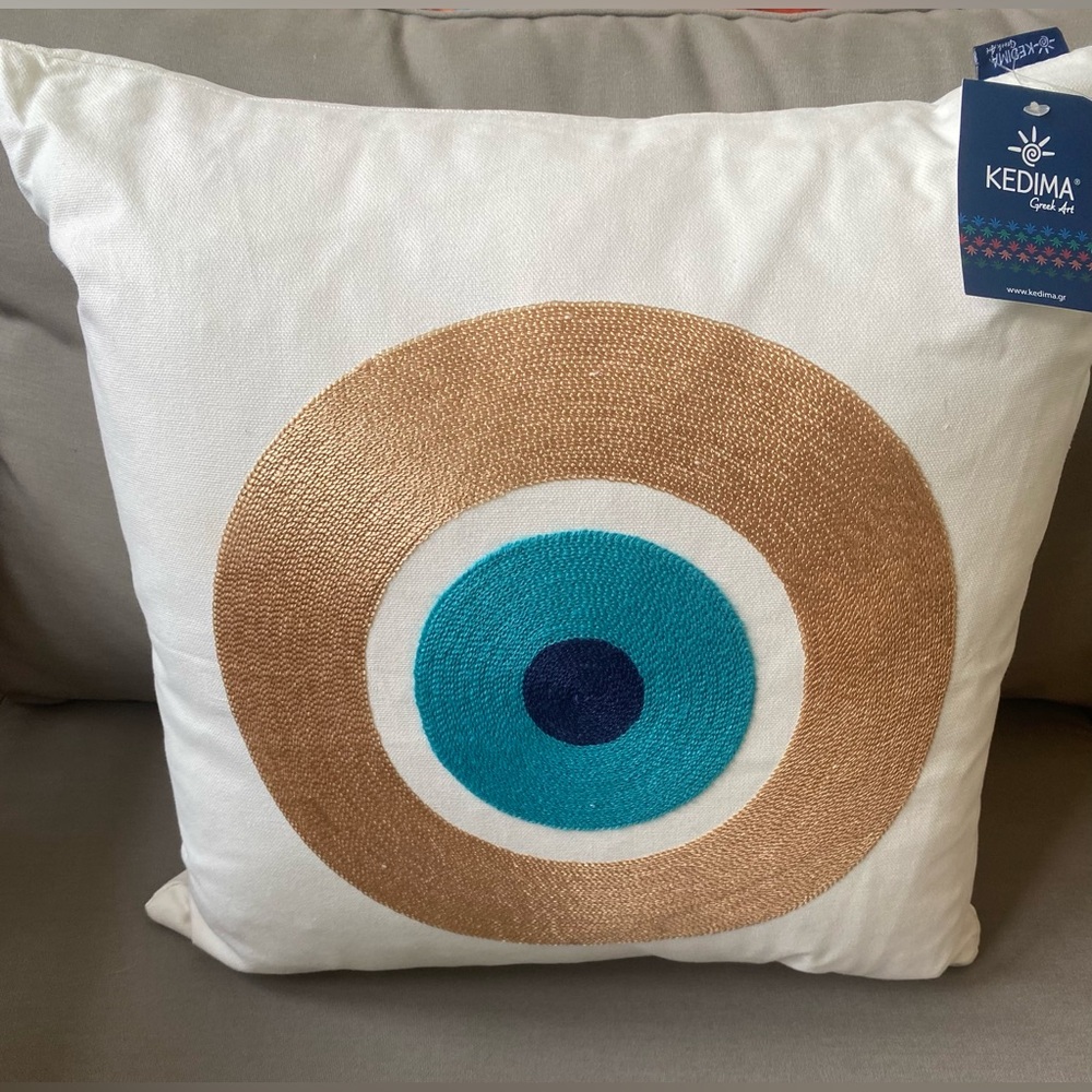 Kedima gold evil eye embroidered pillow cover.